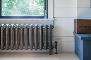 cast iron radiator under window in New Jersey Lakeside home