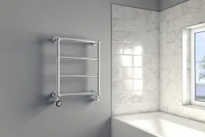 Wall-mounted Elara towel rail in chrome with four bars and angled valves, on a grey wall beside a marble-tiled bath and window.