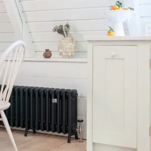 Castrads cast iron radiator finished in Farrow & Ball paint for British Standard Kitchen in upstate New York cabin