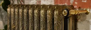 Ornate radiator in aged gold finish