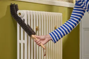 Redecker double stem radiator brush 510502 with Castrads Mercury cast iron radiator in Farrow & Ball Lime White