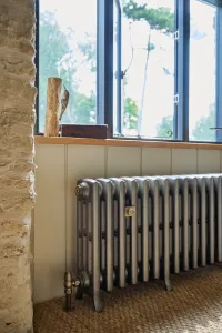 Castrads cast iron radiator in Somerset Mill conversion running a water source heat pump