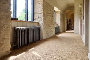 Castrads cast iron radiator in Somerset Mill conversion running a water source heat pump