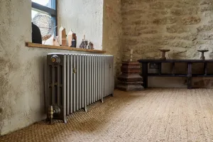 Castrads cast iron radiator in Somerset Mill conversion running a water source heat pump
