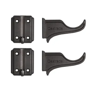 Two Atlas cast iron wall brackets with curved arms embossed Castrads, each beside its four-hole wall plate, in a dark finish on white.