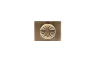 Whitworth wall stay in Antique Brass: a rectangular brushed plate with a round boss embossed with a bee, on a white background.