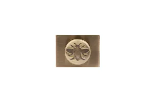 Whitworth wall stay in Antique Brass: a rectangular brushed back plate with a round boss embossed with a bee, on a white background.