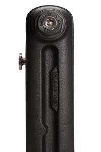 Close-up of the end section of an Emmeline cast iron radiator in Matt Black, with embossed name, Castrads-branded plug and a metal bleed key.