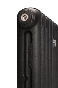 Close-up of the end of an Emmeline cast iron radiator in Matt Black, showing the embossed Emmeline name, a Castrads bleed plug and a chrome fitting.