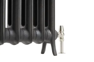 Close-up of the lower end of a plain multi-column Emmeline cast iron radiator in textured dark grey, on cast feet with a polished nickel angled valve.