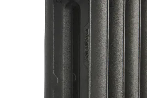 Close-up of the end section of an Emmeline II cast iron radiator in Black Iron, showing its textured columns and raised cast lettering.