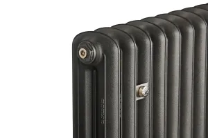 Close-up of the top corner of a plain Emmeline II cast iron radiator in Black Iron, with an end plug and a satin nickel wall stay.