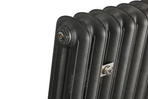 Close-up of the top end of an Emmeline II cast iron radiator in Black Iron, showing rounded columns, a bleed plug and a nickel wall stay.