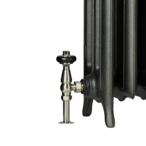 Foot of an Emmeline III cast iron radiator in a dark metallic finish with a satin nickel angled thermostatic valve and black head.