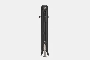 Side view of an Emmeline I 665mm cast iron radiator on feet in Matt Black, with a polished nickel valve at the base and bleed valve at the top.