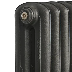 Close-up of the top corner of an Emmeline cast iron radiator in Black Iron, showing the Castrads end plug, embossed name and textured finish.