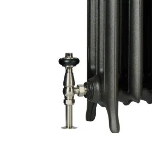 Close-up of the foot of an Emmeline III cast iron radiator in a dark graphite finish with a satin nickel valve and black wooden head.