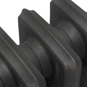 Close-up of plain Grace cast iron radiator sections in a textured dark grey finish, showing the rounded column edges and joints.