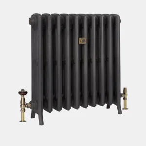Grace 4 Column 660mm cast iron radiator in Matt Black on feet, with antique brass valves, one with a wooden head, and a central brass plate.