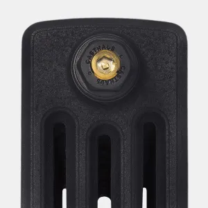 Close-up of the top of a Grace 4 Column cast iron radiator end section in Matt Black, with a Castrads-branded bush and brass plug.