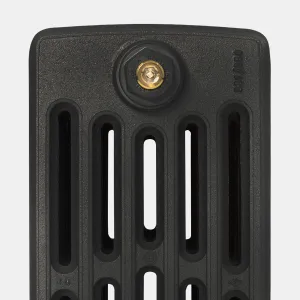 Close-up of the top of a Grace 6 Column cast iron radiator section in Matt Black, with slotted columns and a brass-centred Castrads end plug.