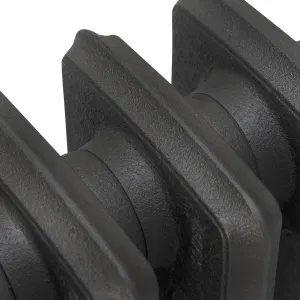 Close-up of the plain sections of a Grace 4 Column cast iron radiator in a textured dark grey finish, showing the joints between columns.