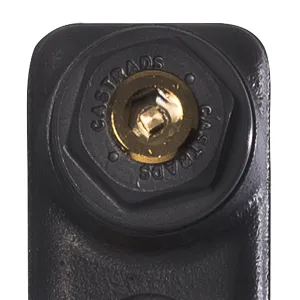 Close-up of the top of a Mercury cast iron radiator section in Matt Black, with a Castrads-stamped hexagonal end bush and brass plug.