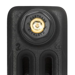 Close-up of the top of a Mercury 3 Column cast iron radiator in Matt Black, showing a Castrads-branded plug with a brass bleed valve.