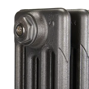 Close-up of the top corner of a plain Mercury 4 column cast iron radiator in Black Iron, showing a Castrads-stamped bleed valve plug.
