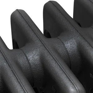 Close-up of plain Mercury cast iron radiator sections in Matt Black, showing the textured cast surface and joins between columns.