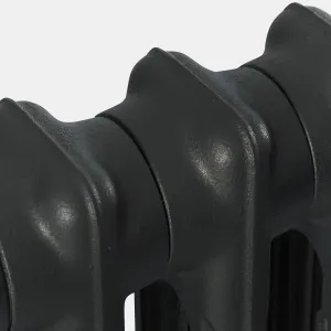 Close-up of the top of a plain Mercury 2 Column cast iron radiator in Matt Black, showing the joined sections and textured cast surface.