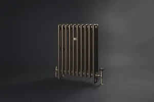 Plain Mercury 4 column 760mm cast iron radiator on feet in Beaten Brass, with brass valves at each end, against a dark grey backdrop.