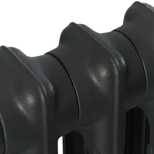 Close-up of the plain rounded top of a Mercury 2 Column cast iron radiator's sections in a dark grey finish, on a white background.