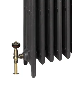 Close-up of the foot end of a plain Mercury cast iron radiator in dark grey, with an antique brass angled valve and wooden-topped head on the left.