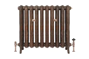 Ornate ten-section Rococo II cast iron radiator in Aged Copper on feet, with two wall stays and copper angled valves, on a white background.