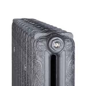Close view of the top of an ornate two-column Rococo II cast iron radiator in Black Iron, with scrollwork and a Castrads-stamped bleed plug.