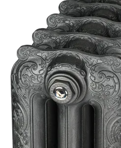 Close-up of an ornate Rococo III cast iron radiator end section with scrollwork, dark iron finish and a polished nickel bleed plug.
