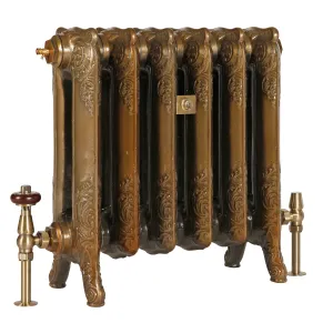 Ornate six-section Rococo II cast iron radiator on scrolled feet in Aged Gold, with brass valves, one with a wooden head, on a white background.