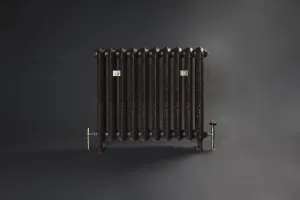 Ornate Rococo II 760mm cast iron radiator on feet in a dark bronze finish, with brass valves at each end, against a dark grey backdrop.