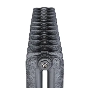 End-on view along an ornate two-column Rococo II cast iron radiator in Black Iron, showing scrolled leafwork and a Castrads-stamped end plug.