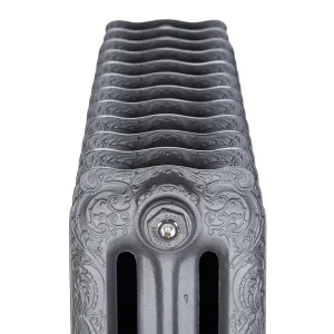 End-on view of an ornate Rococo III cast iron radiator in Black Iron, showing scrolled relief and a chrome Castrads bleed valve plug.