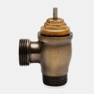 Chatsworth angled thermostatic radiator valve body in Antique Brass, with threaded ends and an exposed brass pin top, on a plain grey background.