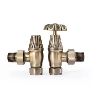 A pair of Chatsworth angled manual radiator valves in Antique Brass with fluted heads, one with an ornate wheel handle, on a white background.