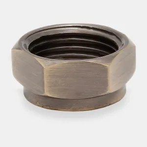 Hexagonal compression nut with an internal thread in a brushed Antique Brass finish, from the Niva angled thermostatic valve, on a pale grey background.