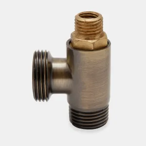 Niva radiator valve body in a brushed Antique Brass finish, a T-shaped fitting with threaded ends and a bare brass insert, on a pale grey background.