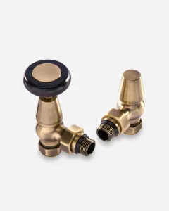 A pair of Windsor Angled Manual radiator valves in Antique Brass, one with a black wooden-style head, the other with a brass lockshield cap.
