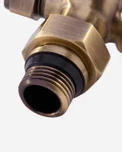 Close-up of the threaded tail and hexagonal nut of a Windsor angled radiator valve in Antique Brass, with a black seal, on a white background.