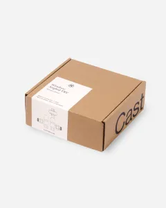 Closed kraft cardboard box with a white label reading Windsor Angled TRV, Antique Brass, with a line drawing of the valve, on a pale grey background.