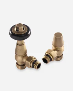 A pair of Windsor angled radiator valves in Natural Brass, one with a black wheel head and one with a plain lockshield cap, on a white background.