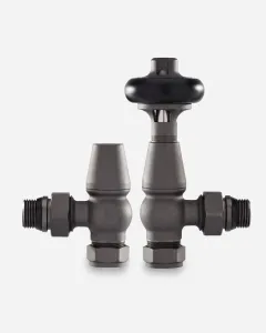Windsor angled thermostatic radiator valve with black head beside its matching lockshield, both in Natural Pewter, on a plain white background.